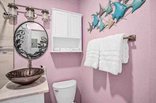 a bathroom with a sink and a mirror and a toilet at Sea Rocket 21 in St. Pete Beach