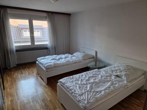 Postel nebo postele na pokoji v ubytování Monteurswohnung Schwarzwald
