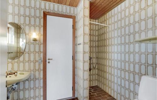 a bathroom with a sink and a mirror at Pet Friendly Home In Thisted With Kitchen in Thisted