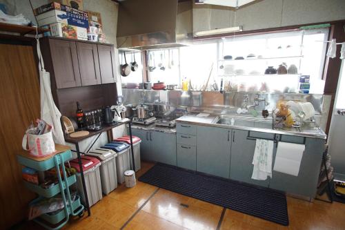 a kitchen with a sink and a counter top at GuestHouse YADOYA - Vacation STAY 08450v in Tokamachi