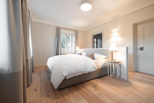 Ένα ή περισσότερα κρεβάτια σε δωμάτιο στο Smart Suites Kaltern - Apartments am Kalterer See