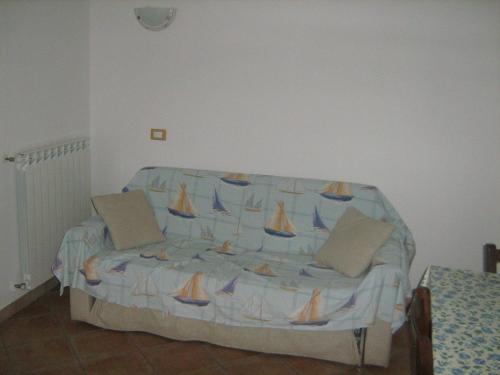 a couch with sails on it in a room at Poggio Picchio in Bibbona