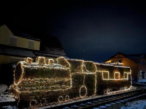 a train covered in christmas lights on the tracks at Pension Lavendel in Harztor