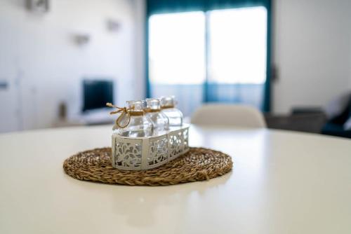 a couple of glass jars sitting on top of a table at Apartamento Delta in Deltebre