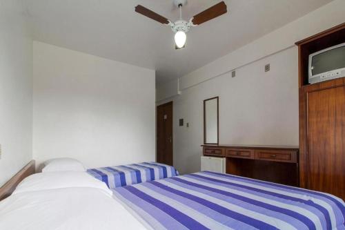 Cama o camas de una habitación en Hotel Kimar