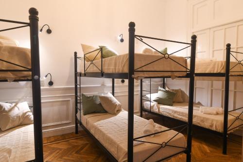 a room with three bunk beds in it at Cambacuá in Buenos Aires