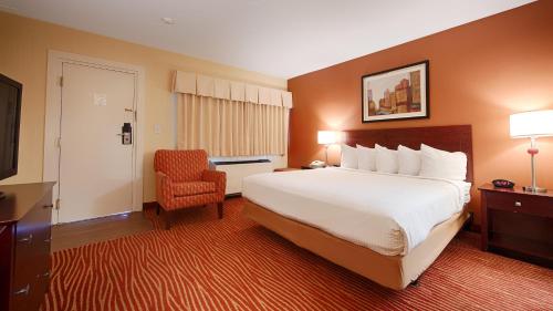 Hotel Boston tesisinde bir odada yatak veya yataklar