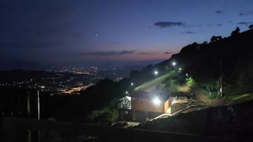 a view of a city at night at Villa unforgettable in Sarajevo