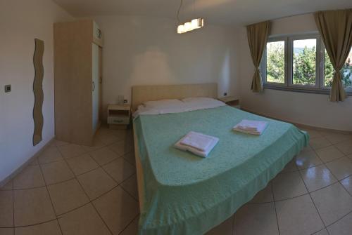 Katil atau katil-katil dalam bilik di Vis a Vis Apartments