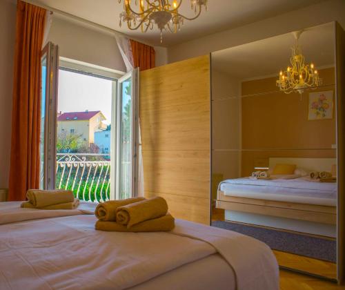 Posteľ alebo postele v izbe v ubytovaní Apartments MM