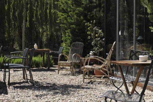 a group of chairs and tables in a yard at L'Aixart Aiguablava Hotel in Begur