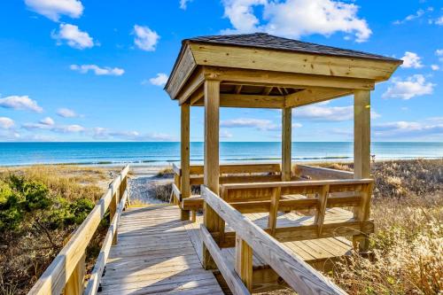 a wooden boardwalk to the beach at Dunescape Villas 211 in Atlantic Beach