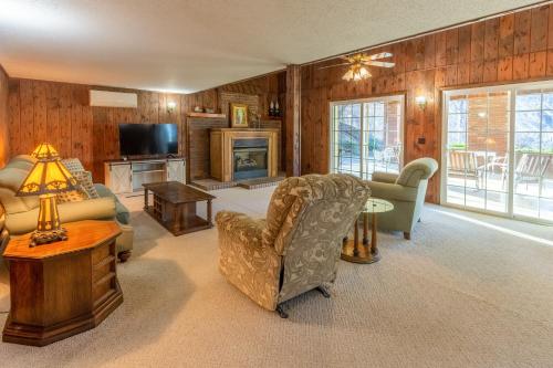 a living room filled with furniture and a fireplace at Cardinal's Nest in Cullowhee