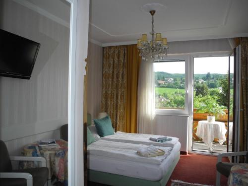Ein Bett oder Betten in einem Zimmer der Unterkunft Hotel Rosner