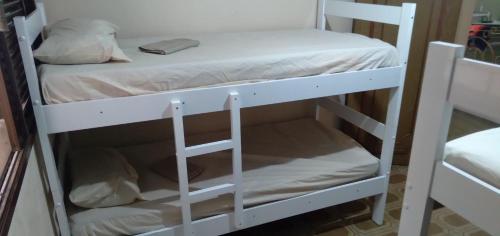 a couple of bunk beds in a room at Conceitual Hostel Natal in Natal