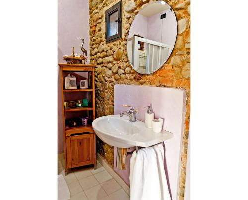 a bathroom with a sink and a mirror at Villa Sunflower in Montelupo Fiorentino
