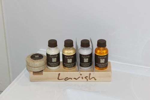 four bottles of essential oils sitting on a table at Quality Inn Acapulco Taupo in Taupo