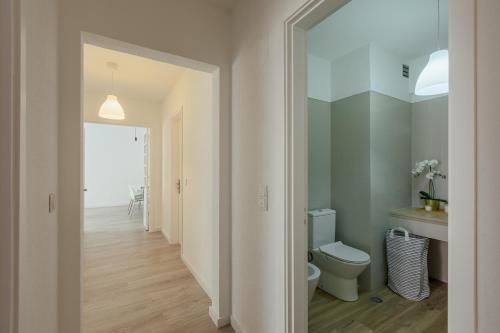 a bathroom with a toilet and a sink at Elegant 3 bedroom apt - City centre - garage - metro in Lisbon