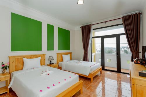 Ένα ή περισσότερα κρεβάτια σε δωμάτιο στο Sea and Sand Hotel