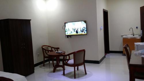 Televízia a/alebo spoločenská miestnosť v ubytovaní Hana Yanbu Hotel Apartments