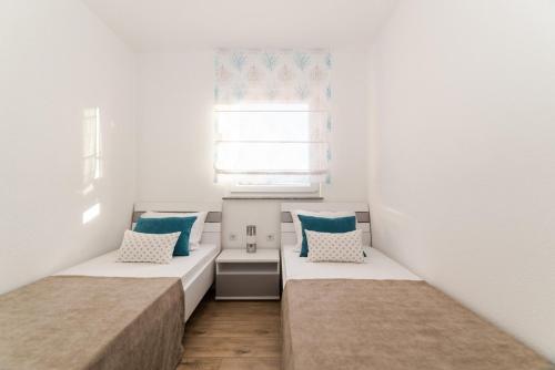 Postel nebo postele na pokoji v ubytování Apartments Kovacevic