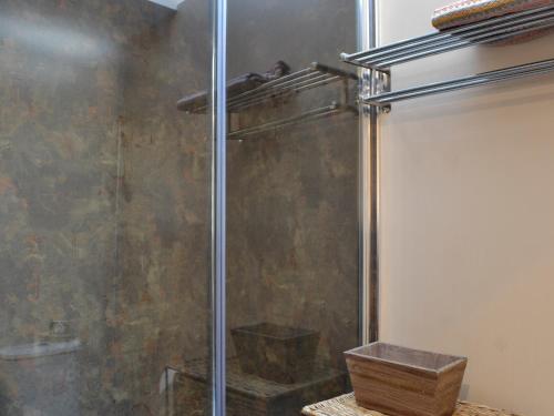 a shower stall in a bathroom with a wooden box at The Stables - Uk41958 in Laurieston