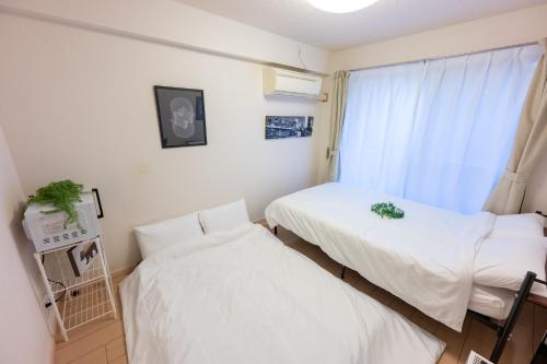 Cama o camas de una habitación en LUANA in BELUBEE