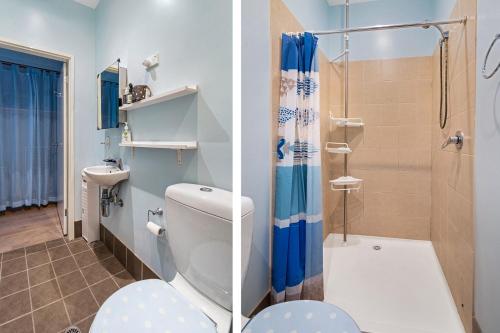 a bathroom with a toilet and a shower at Orion Blue Beach Stay Vincentia in Vincentia