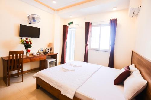 Giường trong phòng chung tại Quy Nhon Blue Sea Hotel