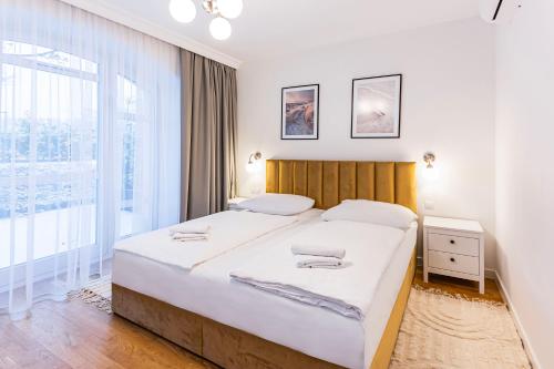 Posteľ alebo postele v izbe v ubytovaní VacationClub – Wisus Apartament 4