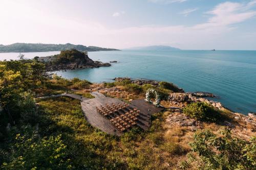 an aerial view of a small island in the water at Cape Fahn Hotel - Private Islands Samui in Choeng Mon Beach