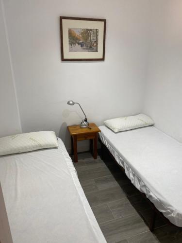 Ένα ή περισσότερα κρεβάτια σε δωμάτιο στο Apartamento alto standing con piscina privada, aire acondicionado y wifi