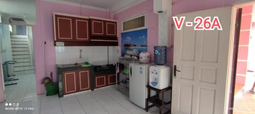 A kitchen or kitchenette at villa berastagi mas