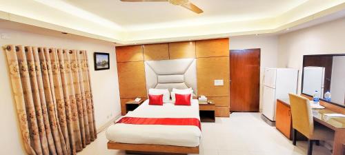 Ένα ή περισσότερα κρεβάτια σε δωμάτιο στο Hotel Afford Inn