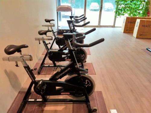 a row of exercise bikes in a room at SCC Velodrome KL in Kuala Lumpur