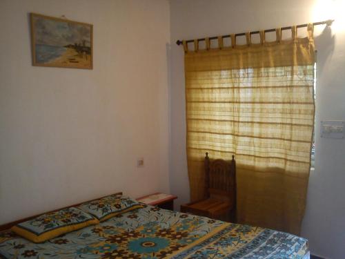 Postel nebo postele na pokoji v ubytování Adilson Guest House
