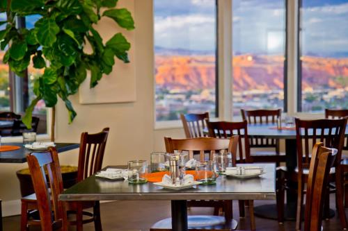 a dining room table filled with plates of food at Inn On The Cliff in St. George