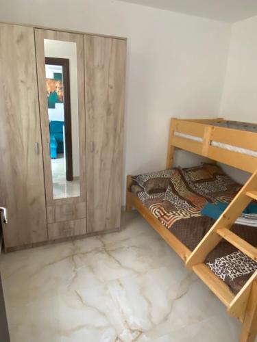 a room with two bunk beds and a mirror at Elite in Ostrovo