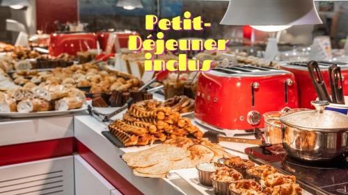 a buffet of pastries and other food on a counter at Ibis Styles Strasbourg Centre Gare in Strasbourg