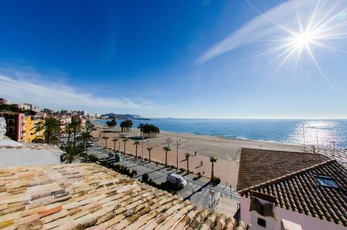 a view of the beach from the roof of a building at HAPPYVILA Fisher House in Villajoyosa