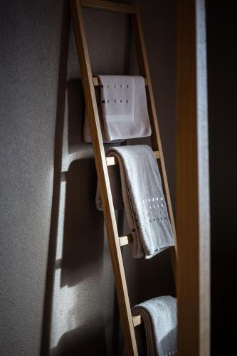 a ladder with towels on it in a room at Panorama Hotel & Restaurant in Bettmeralp