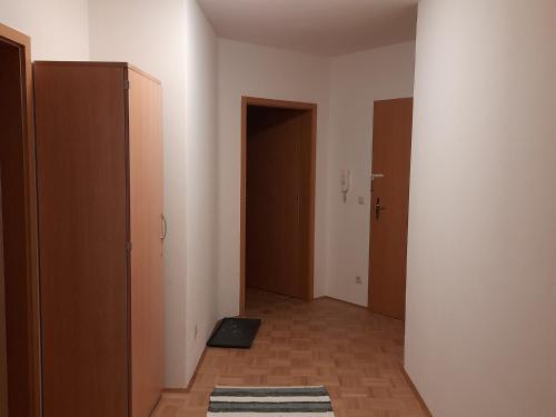 an empty hallway with two doors and a rug at Ferienwohnung Paul in Bad Reichenhall