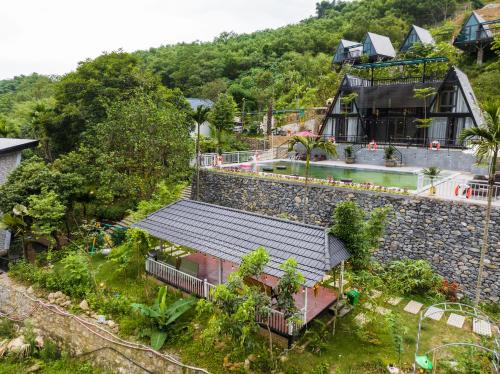 an aerial view of a house with a building at Les Bois BaVi by HOLO Serviced HomeStay in Hanoi