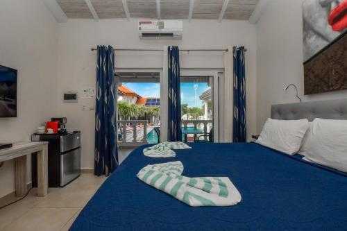 Postel nebo postele na pokoji v ubytování Boutique Hotel Swiss Paradise Aruba Villas and Suites