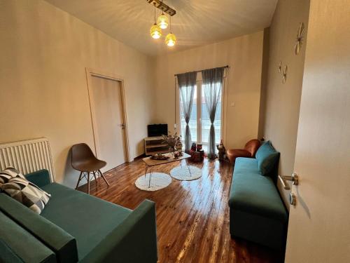 a living room with a couch and a table at Helen's Art House in Pýli