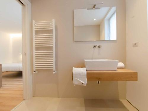 a bathroom with a sink and a mirror at Pascià Boutique Hotel in Ragalna