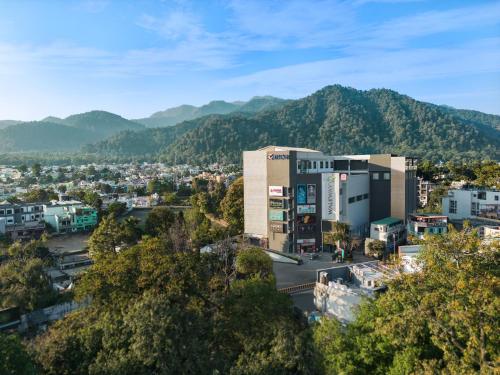 an aerial view of a city with mountains in the background at Fortune Walkway Mall, Haldwani - Member ITC Hotels' Group in Haldwāni