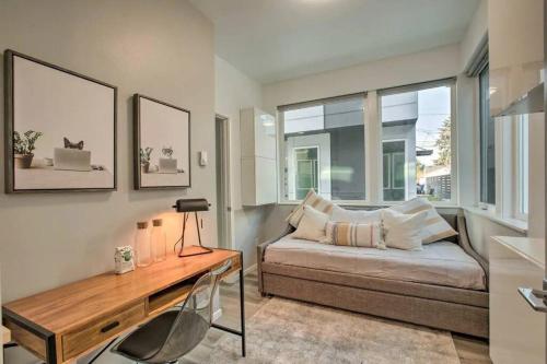 a bedroom with a bed and a desk and windows at 4 Bed Modern Townhouse, WFH Office, Rooftop in Seattle