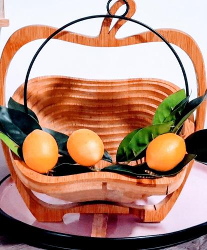 a basket filled with oranges on top of a table at Sunny-side-up in St Austell