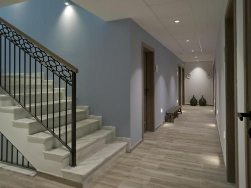 a hallway with stairs and a stair railing at Hotel Boutique Balandret in Valencia